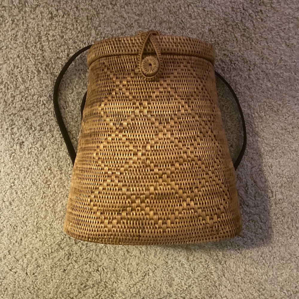 Woven basket backpack with leather straps